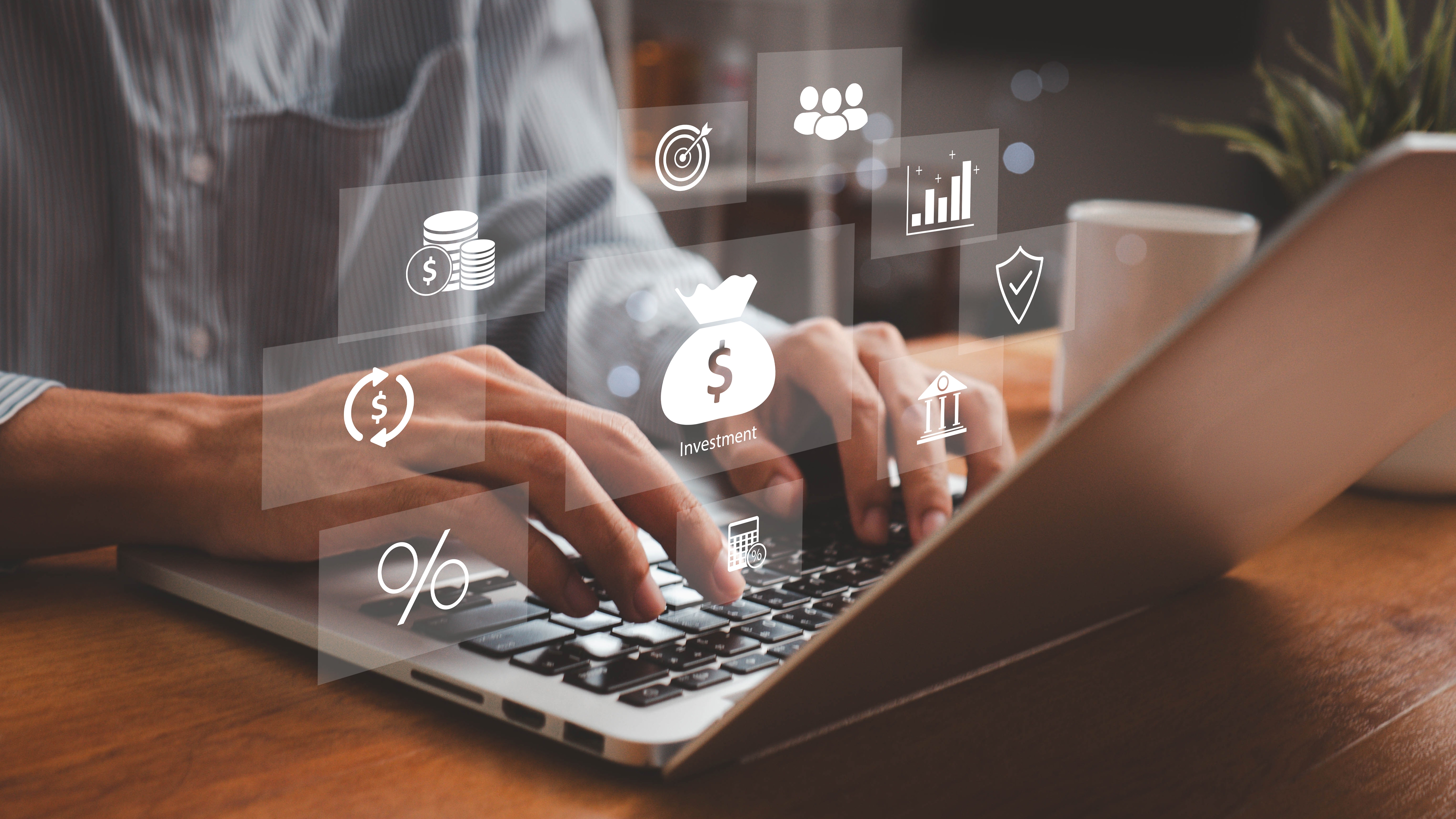 Person at Laptop with Accounting symbols spread around